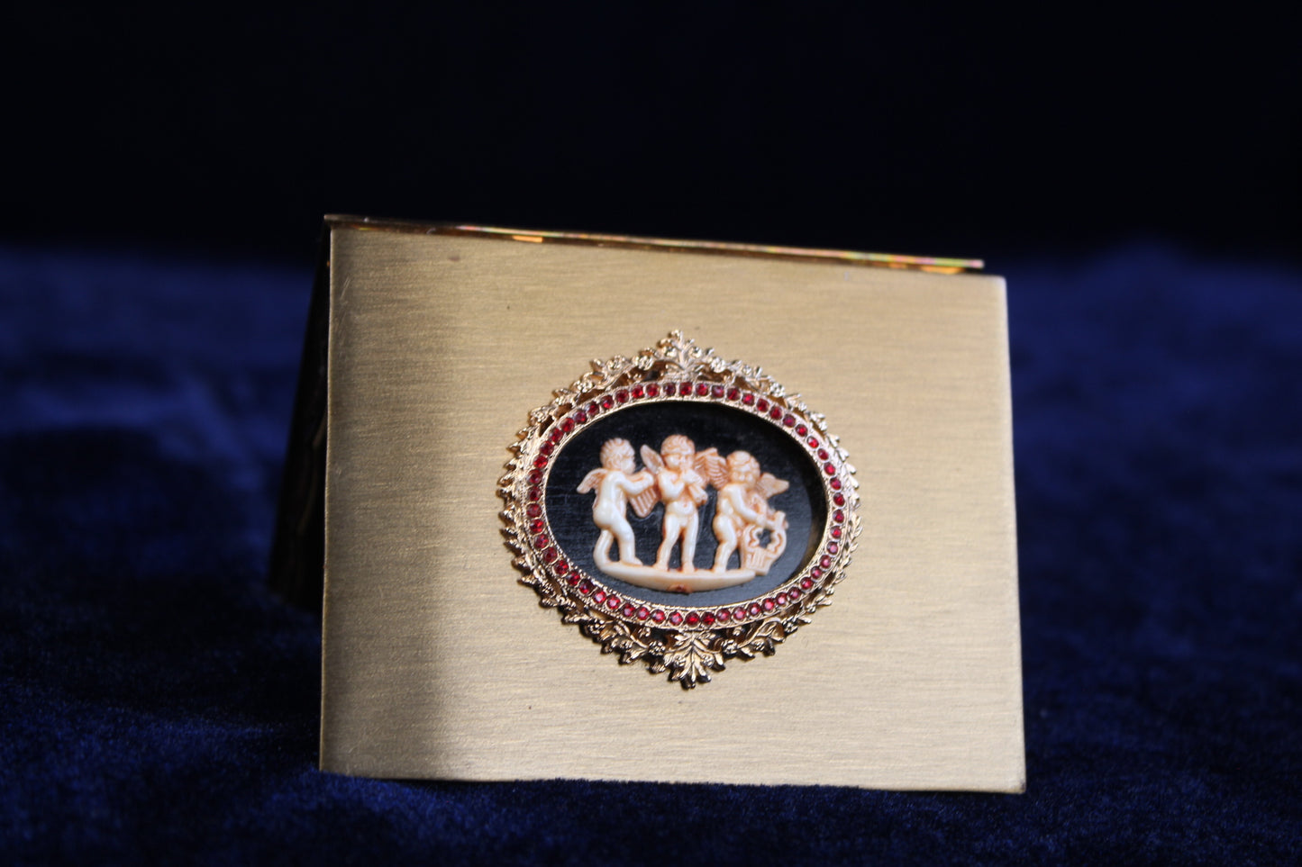 1940s Volupte Compact – Cherub Cameo with Ruby Rhinestones, Gold-Tone Vanity Compact