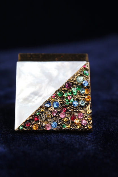 1940s compact with mother-of-pearl and gold filigree with colorful rhinestones.